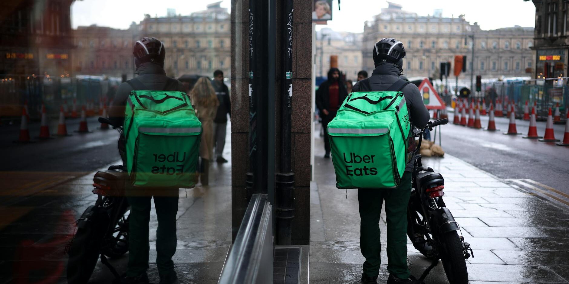 uber eats courier reflected in street mirror edinburgh